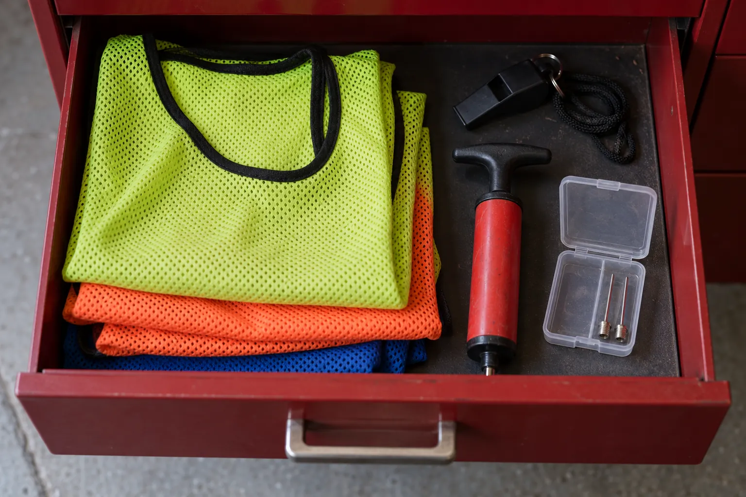 Illustration: Training accessories inside a dark-red equipment drawer.