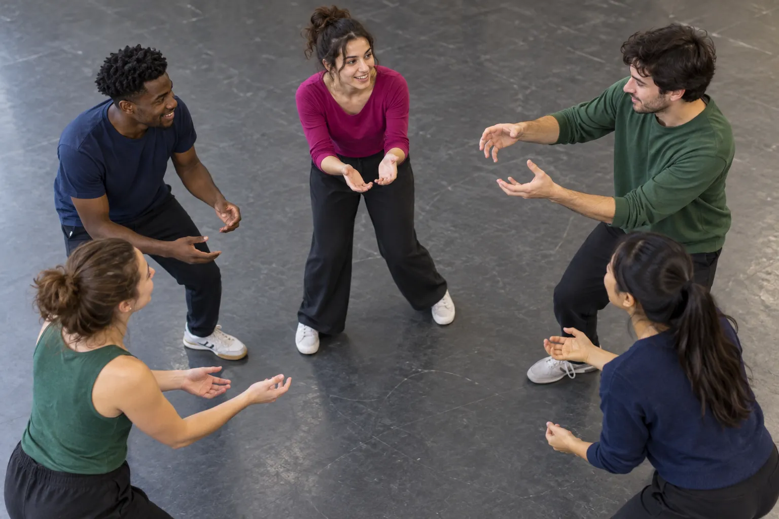 Illustration: Five young adults rehearsing a restrained improv exercise.