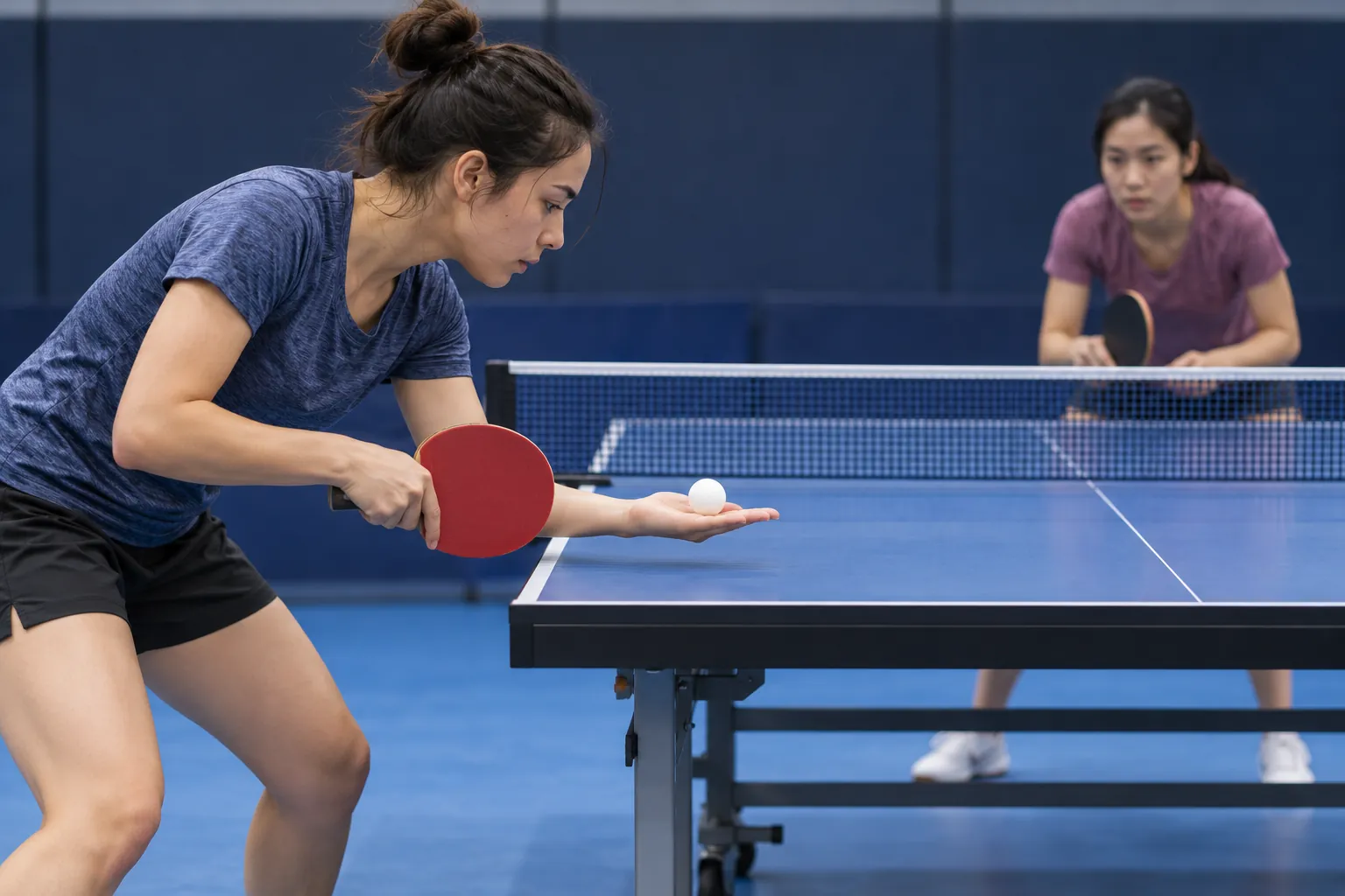 Illustration: A young adult woman prepares a table-tennis serve as her opponent waits across the table.